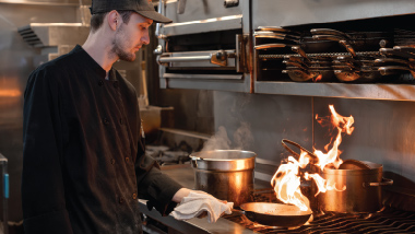 adam cooking at the stove