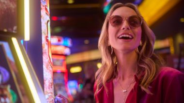 woman playing on a slot machine