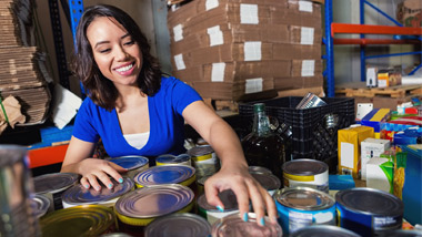 Woman sorting cans