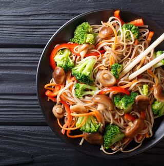 Asian noodle dish with chop sticks