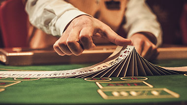 Poker Dealer moving cards