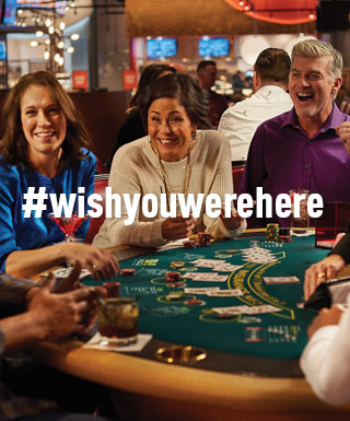 group playing blackjack with text "#WishYouWereHere"